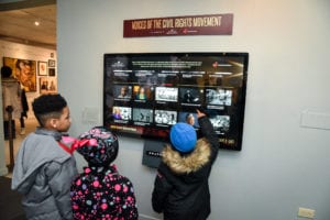 group looking at a tv