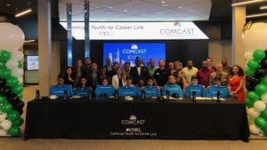 Participants in the “Youth-to-Career Link” (CY2CL) program sit at a long table.