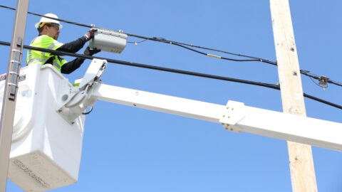 Worker Installing Cable Lines