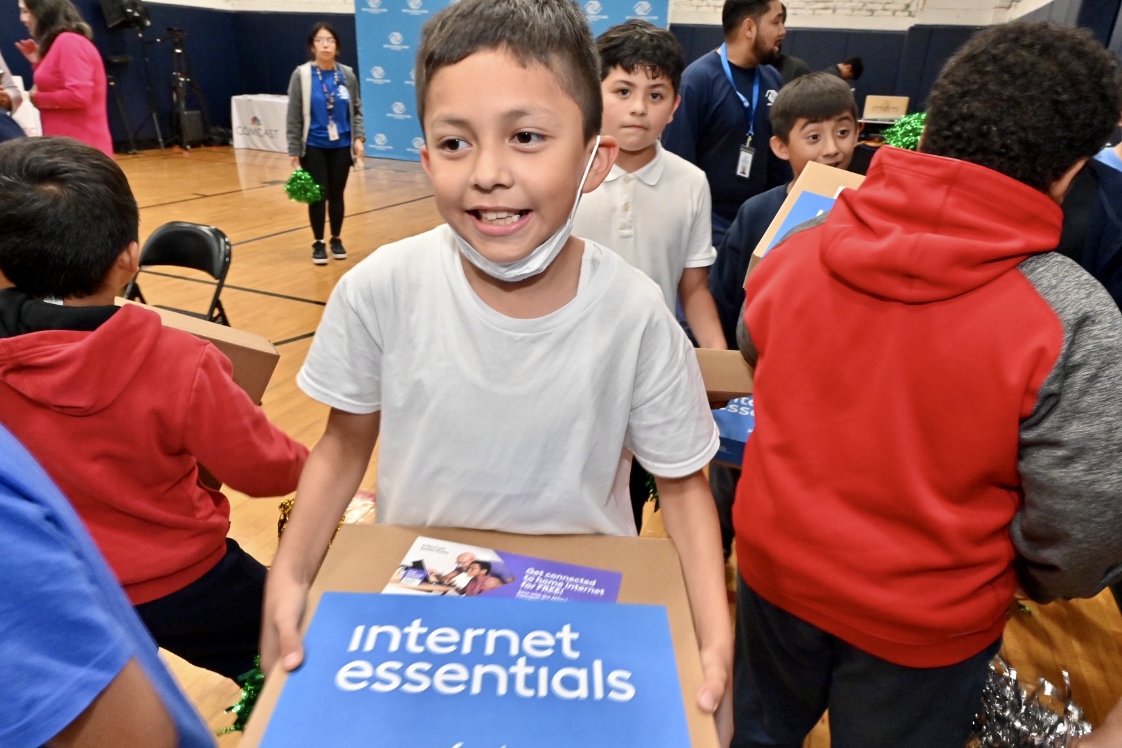 Young Boys & Club member celebrates his brand new laptop donated by Comcast in efforts to advance digital equity in Chicago.