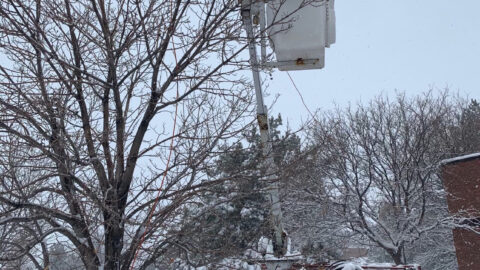 Comcast technician working after a snowstorm.