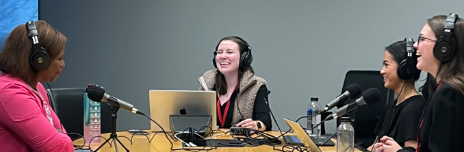 Stephanie Rideau recording a podcast with the STEMblazers Podcast hosts.
