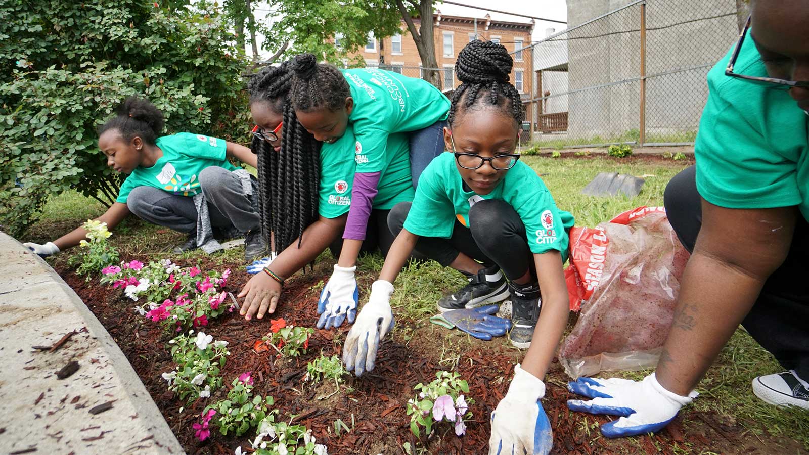 Comcast Cares Day volunteers gardening