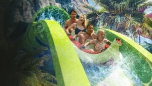 Family on waterslide at Volcano Bay