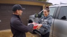 An Xfinity technician helps a customer.
