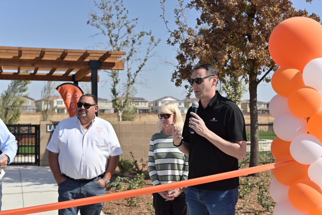Nathan Ahle, Director of Government Affairs for Comcast, provide remarks at grand opening of Rosie's Place Dog Park at Tesoro Viejo in Madera County