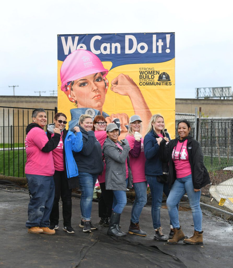 Comcast volunteers for Habitat for Humanity's Women Build help build a home during a Team UP event on Friday, March 1, 2023 in Sacramento, Calif.