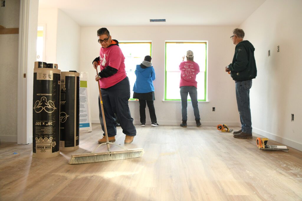 Comcast volunteers for Habitat for Humanity's Women Build help build a home during a Team UP event on Friday, March 1, 2023 in Sacramento, Calif.