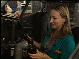 Sabrina Register sitting at airplane controls