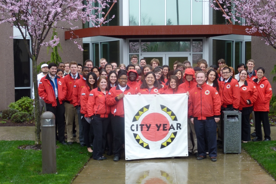 Group pictures of Seattle City Year corps members in front of Comcast HQ in Lynnwood, WA