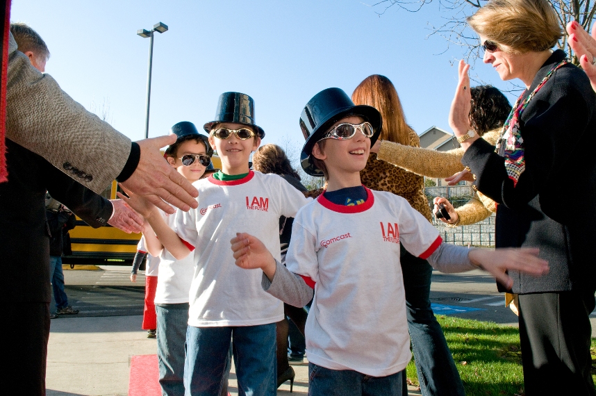 Woodside Elementary School students walk the Red Carpet as the Comcast Big Brothers Big Sisters event comes to Washington state.