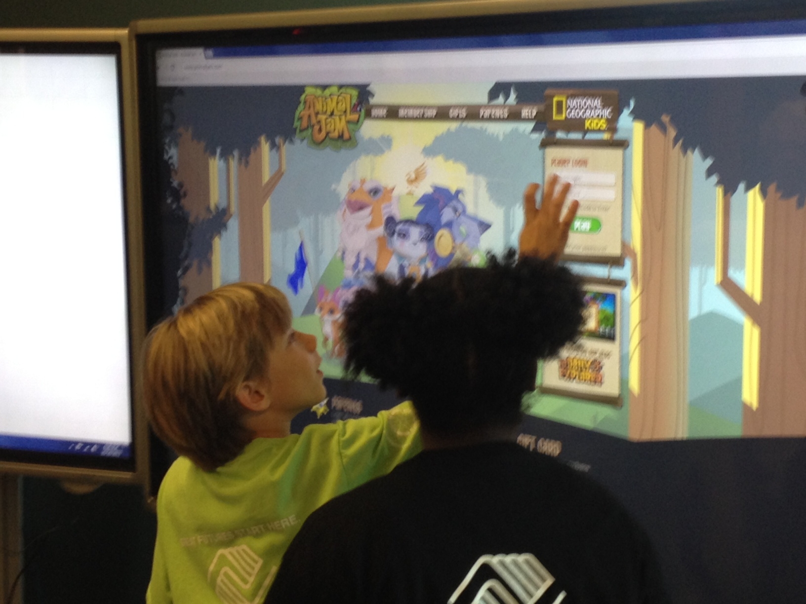 youth playing with a smart panel at the Bremerton Teen Center