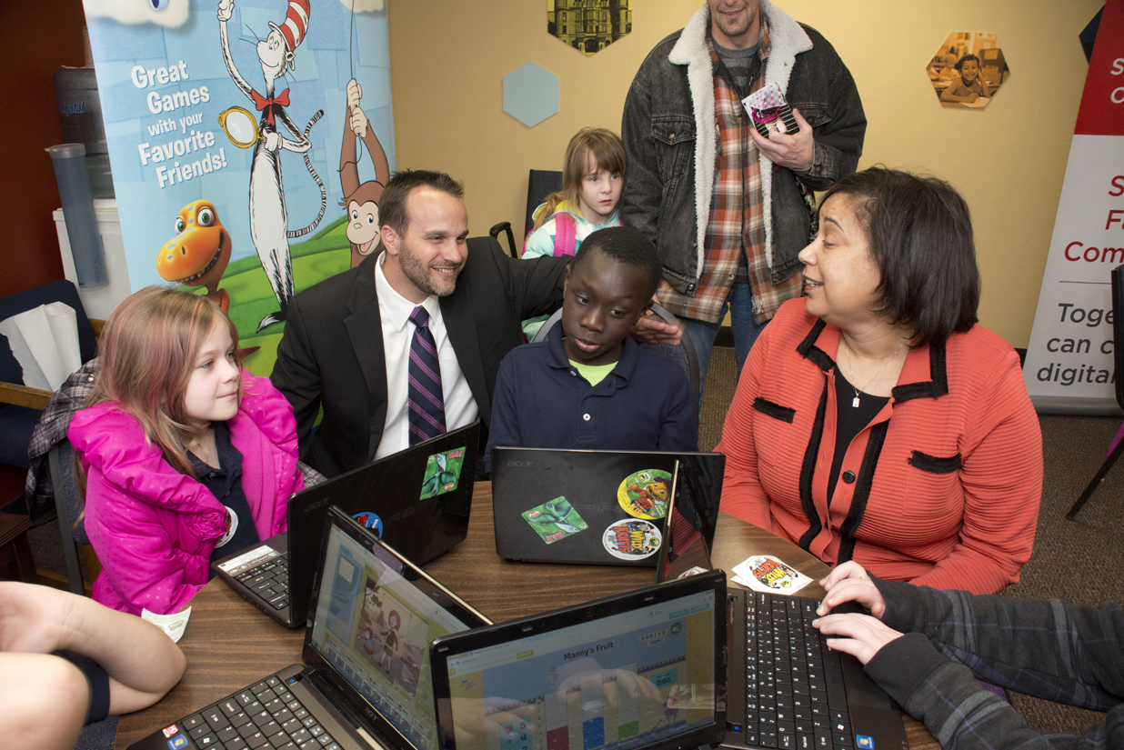 Comcast Director of Government Affairs Hans Hechtman, left, and Tacoma Urban League CEO Victoria Woodards, right, get an impromptu tech demo from a McCarver Elementary student who has been participating in KBTC youth camps and who was at our news announcement this week at the Foundatoin for Tacoma Students offices. For more information about the Internet Essentials Gold Medal Awards in Tacoma, please click on the picture. 