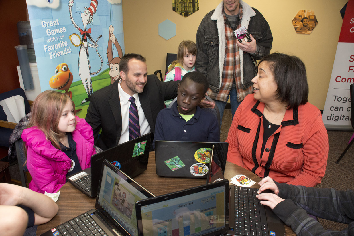 Comcast Director of Government Affairs Hans Hechtman, left, and Tacoma Urban League CEO Victoria Woodards, right, get an impromptu tech demo from a McCarver Elementary student who has been participating in KBTC youth camps and who was at our news announcement this week at the Foundatoin for Tacoma Students offices. For more information about the Internet Essentials Gold Medal Awards in Tacoma, please click on the picture.