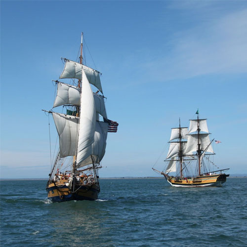 2 tall ships in the water