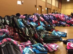 Photo of dozens of backpacks