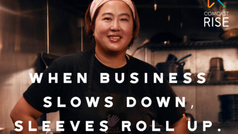 A woman stands in a kitchen with copy which reads "When business slows down, sleeves roll up.
