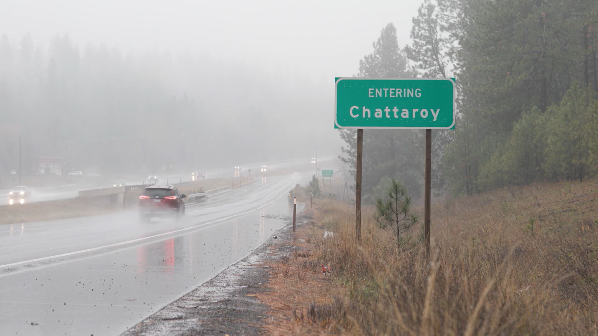 The entering Chattaroy sign by the highway.