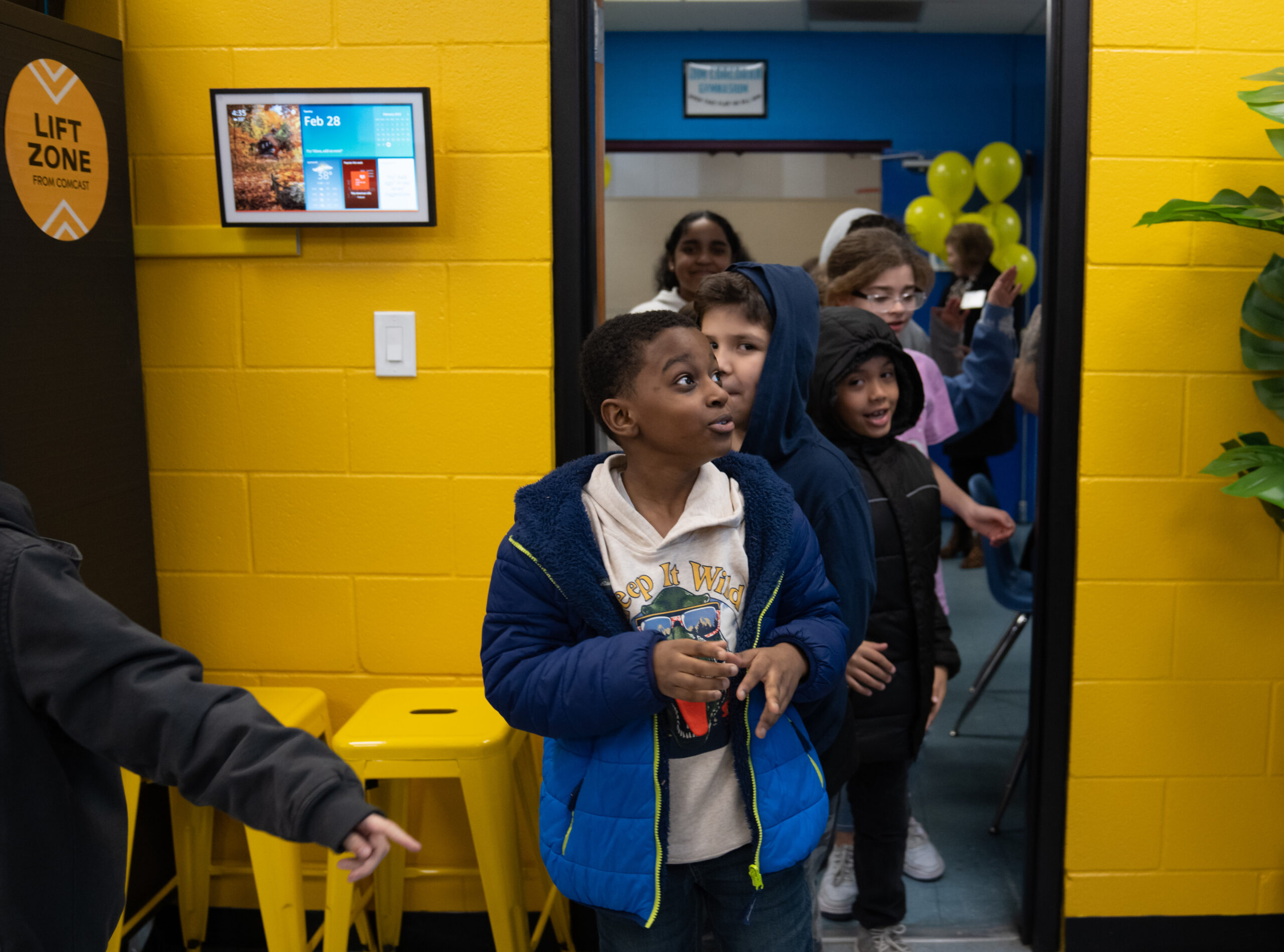 Kids from the Boys & Girls Club enter the Enhanced Lift Zone. 