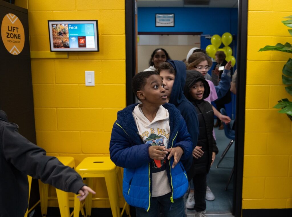 Children walk into a Lift Zone Lab. 