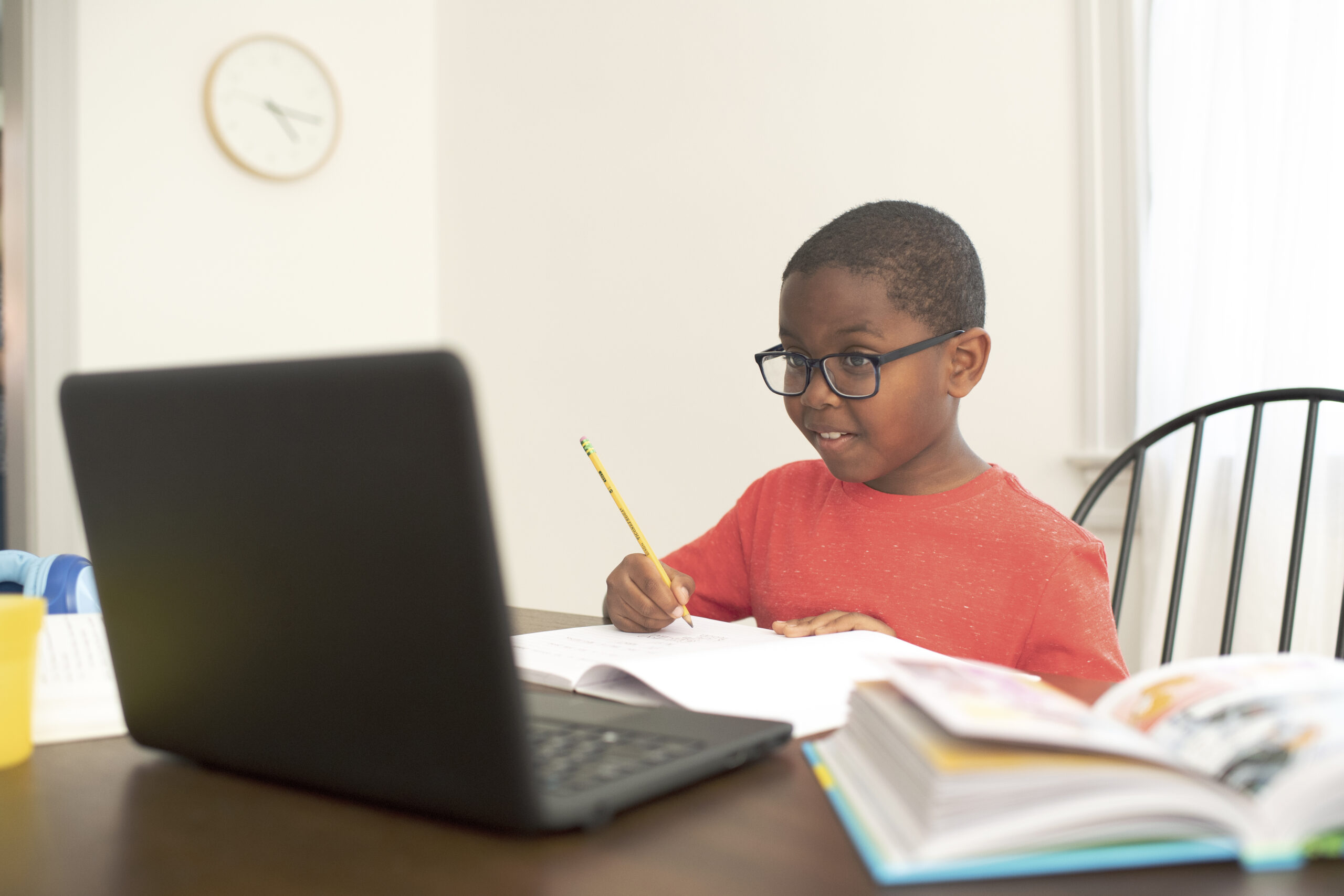 Child sitting at desk doing homework