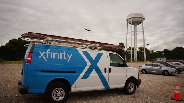 Xfinity van parked near water tower