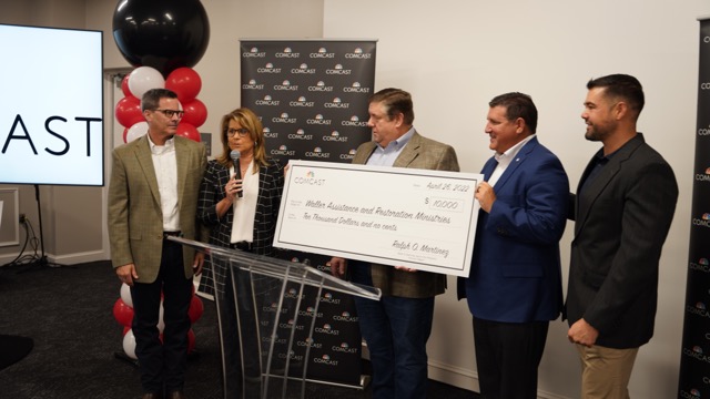 Comcast’s Mitch Danklef, Toni Beck, and Nicolas Jimenez present Waller Assistance and Restoration Ministries’ Eric Kulbeck and Tom Dobbs with a $10,000 grant check.