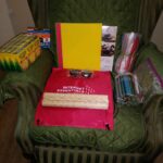 School supplies and Internet Essentials bag placed on green armchair