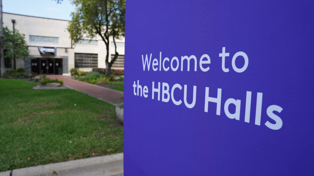Close up of purple sign stating Welcome to the HBCU Halls