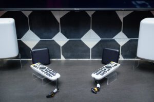 Two remotes displayed on table
