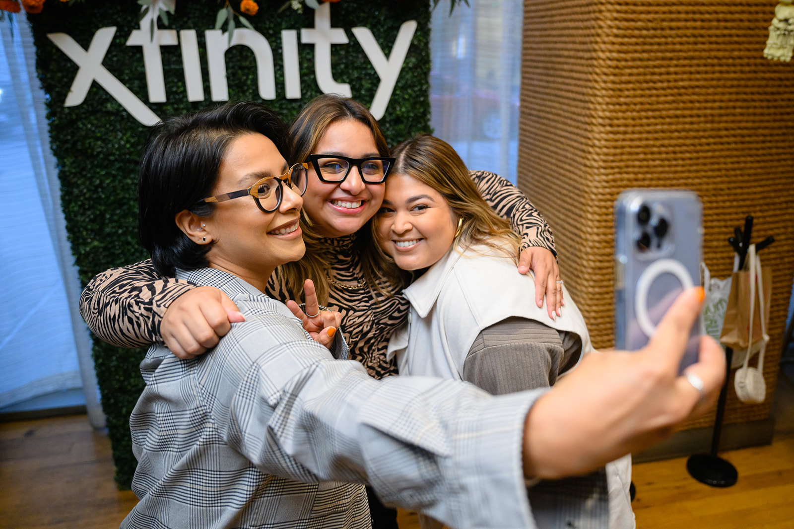 Three women smiling and posing for a selfie