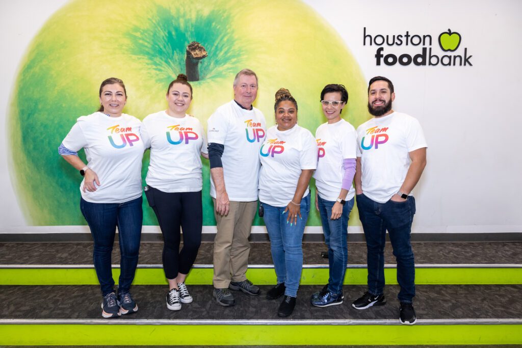 Team Up volunteers posing for a picture at Houston food bank.