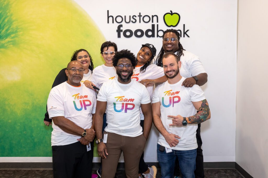 Team Up volunteers posing for picture at Houston food bank.