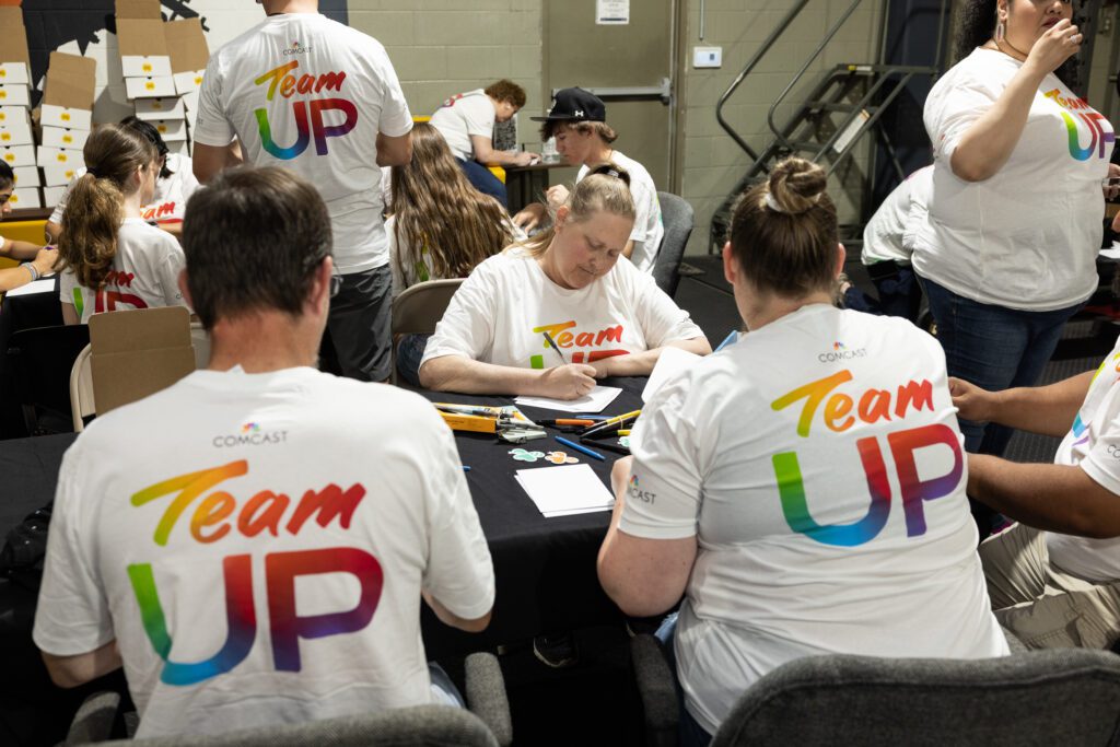Group of Team Up volunteers working at a table