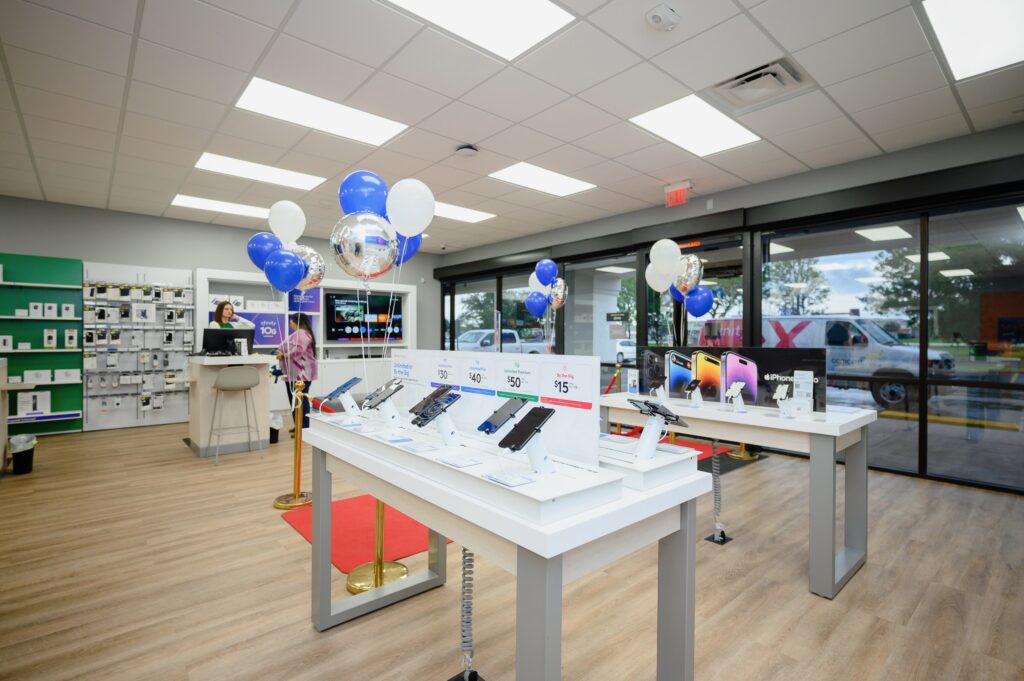 Inside store featuring tables with cell phones