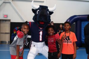 Houston Texans and Crime Stoppers Join Tech Leader to Surprise Youth