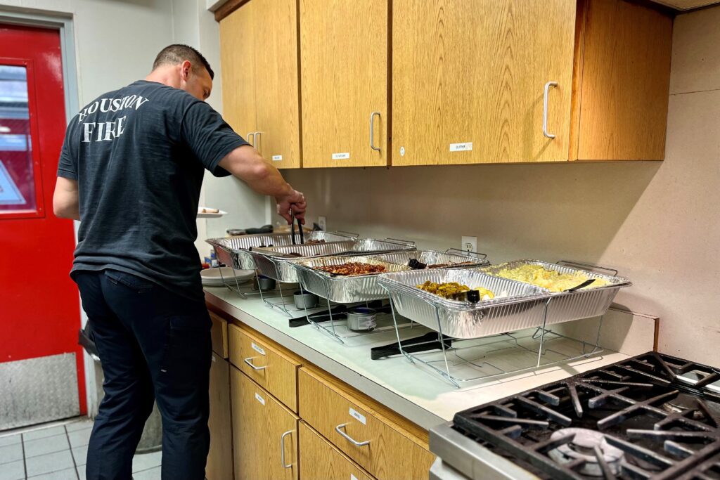 Kingwood firefighter serving food