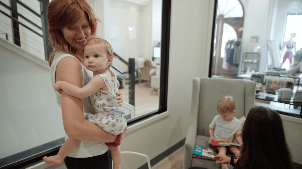 Vessel Pilates client holding her daughter 