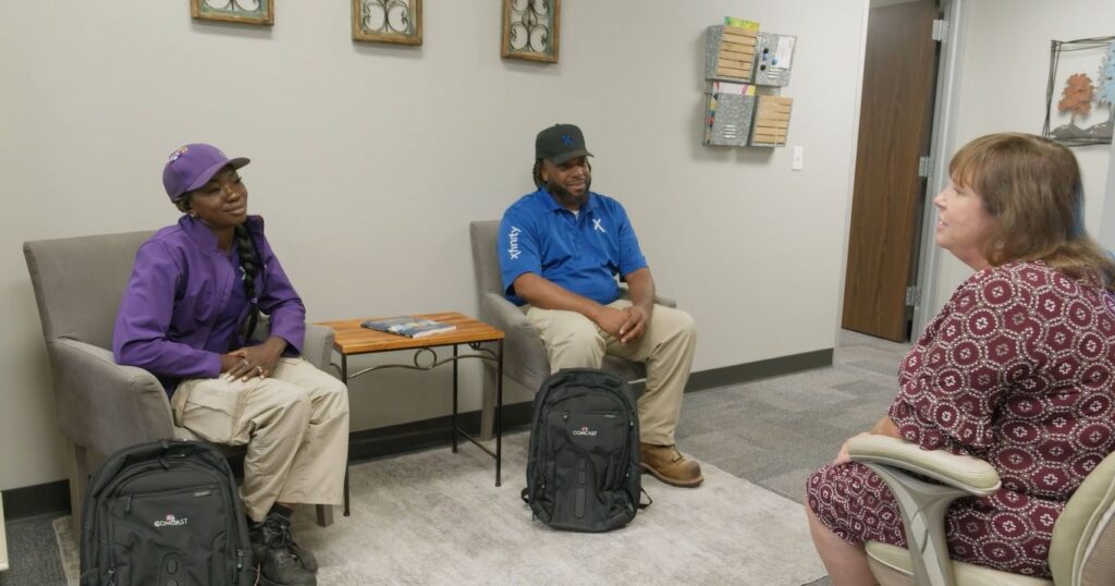 Xfinity technicians meet with school principal