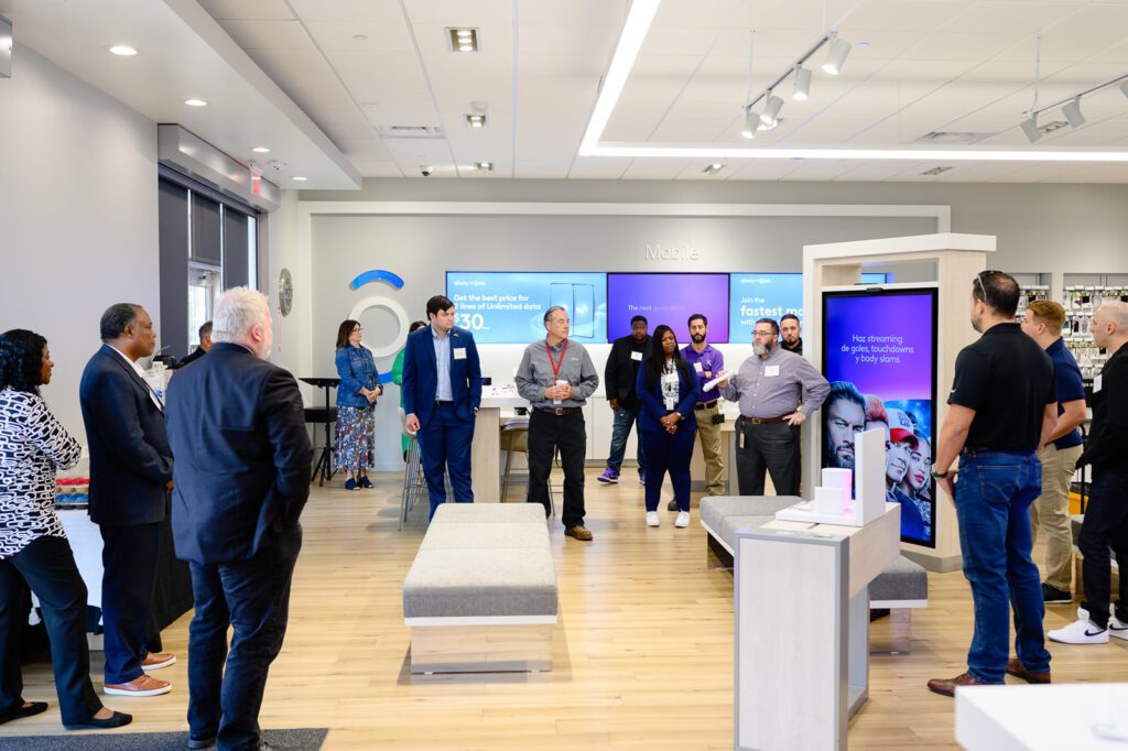 Comcast team and elected officials gather inside Xfinity store