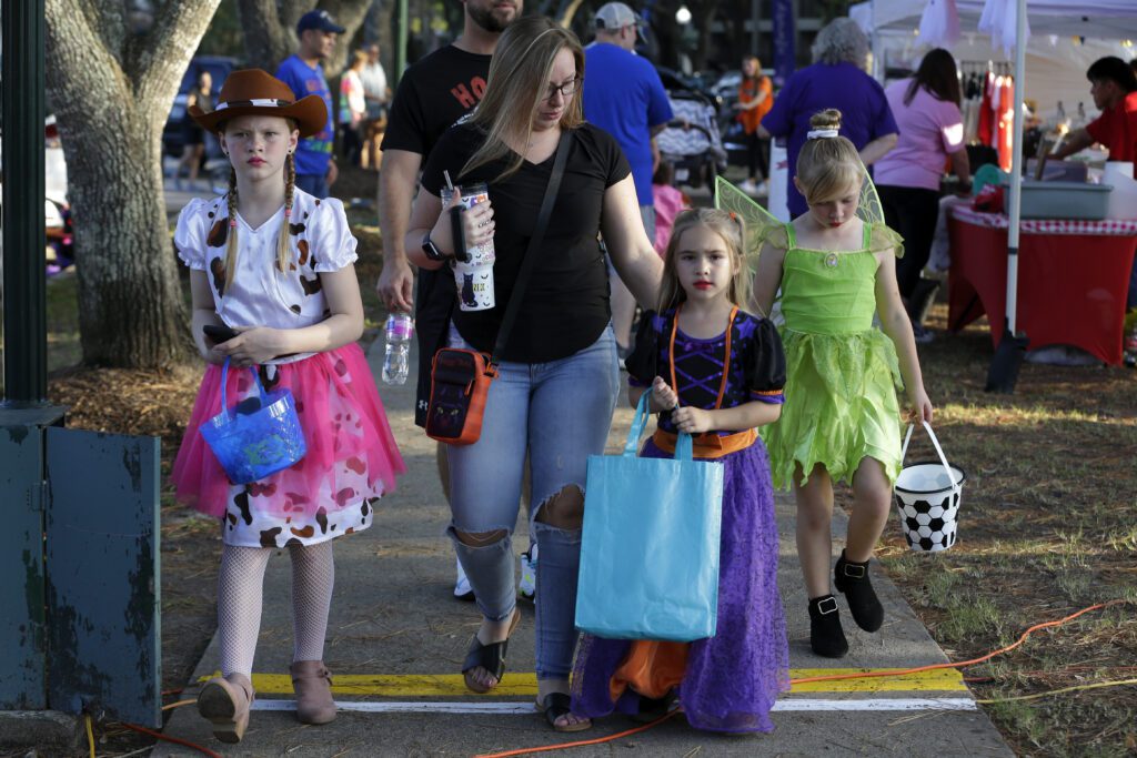 Attendees enjoy the festivities during the Comcast Kingwood Takeover, held at the Kingwood Town Center Park on Saturday, Oct. 28, 2023 in Kingwood, TX. (Michael Wyke/AP Images for Comcast)