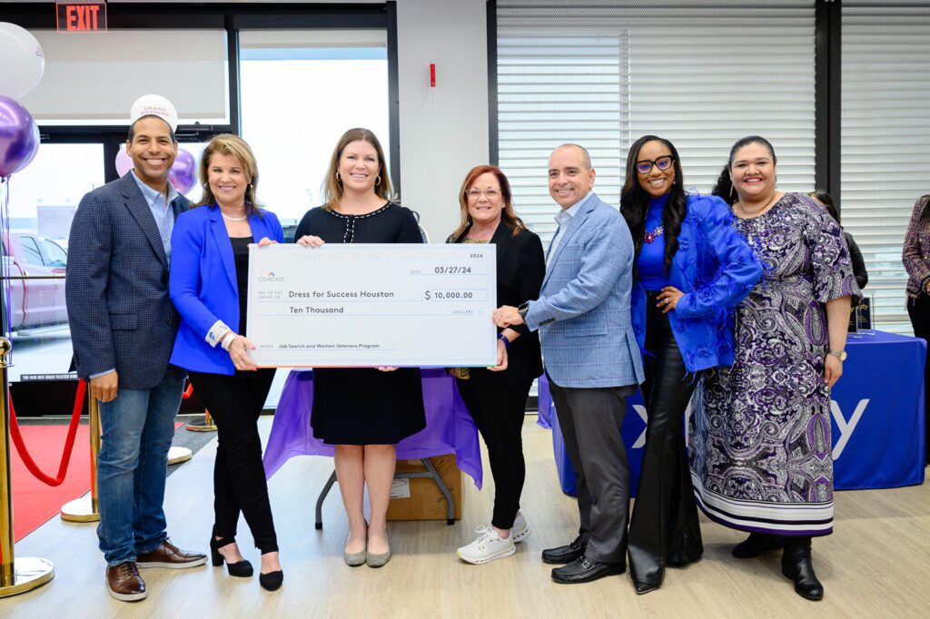 Comcast presents Dress for Success Houston with check 