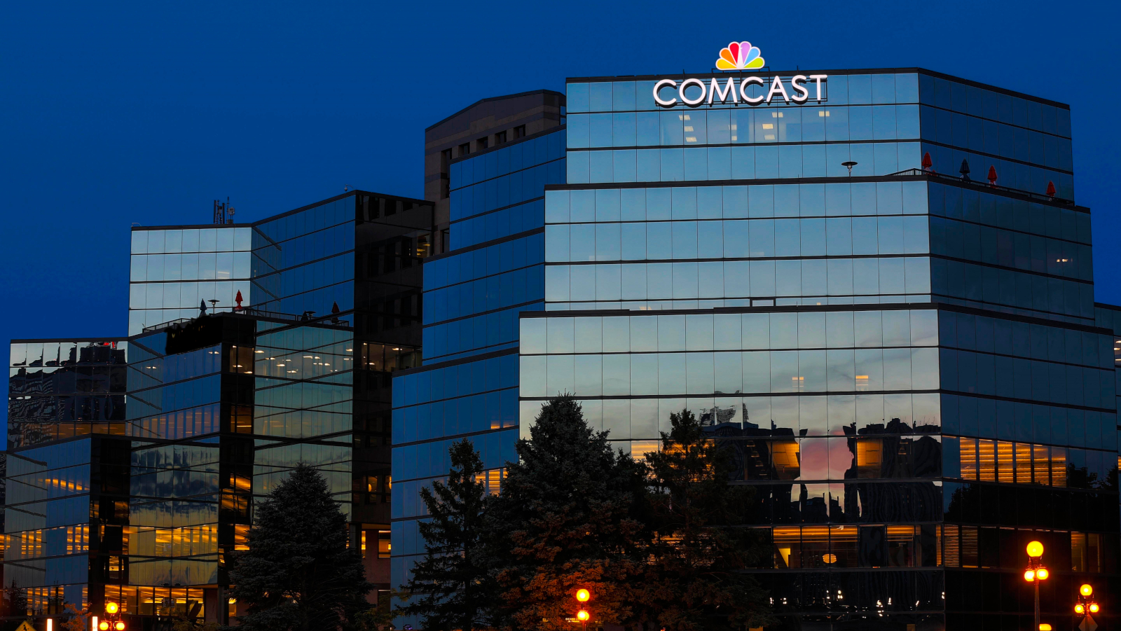 Exterior view of the Comcast Twin Cities Regional office at dusk.
