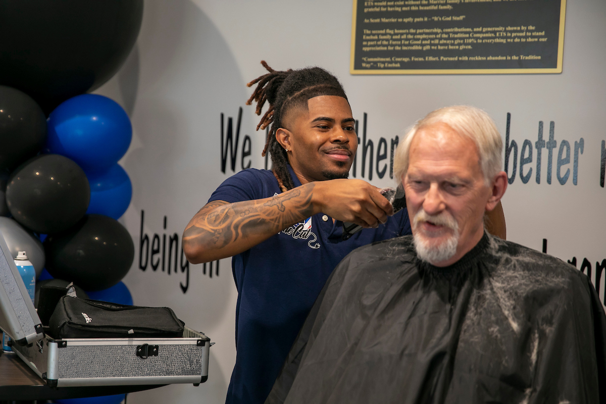 Veteran receiving a haircut