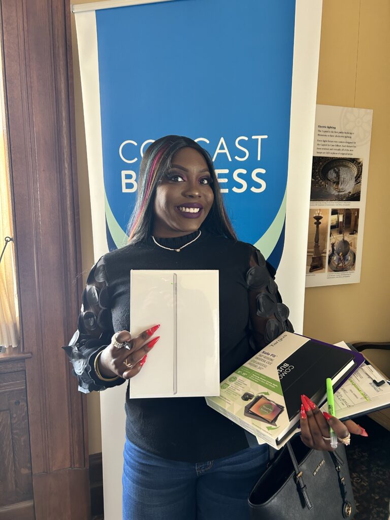 Racquel Wililams of PFund Foundation received a free iPad courtesy of Comcast Business.