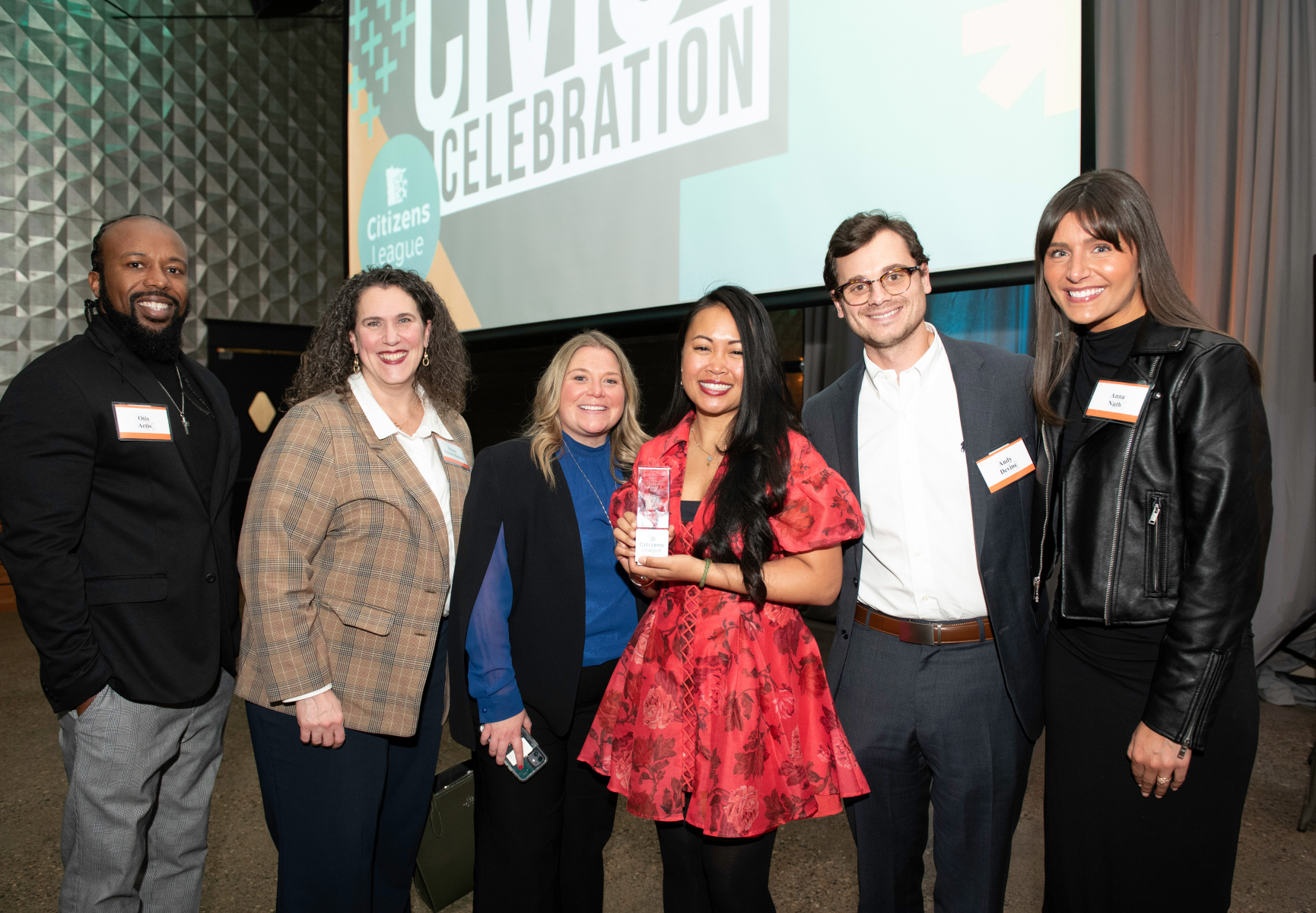 Comcast employees stand with Civic Changemaker Award recipient, Sina War, at the 2024 Civic Celebration.