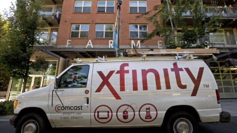 Xfinity truck in front of brick building