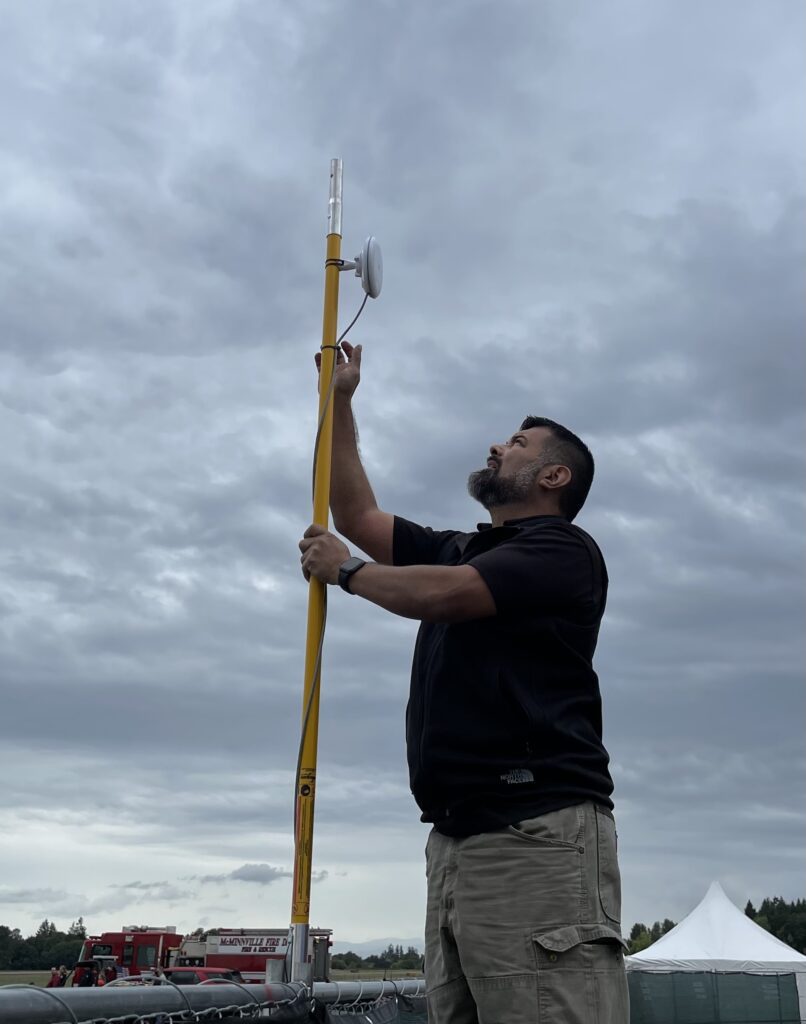 Edwin Pereira works setting up cable. 