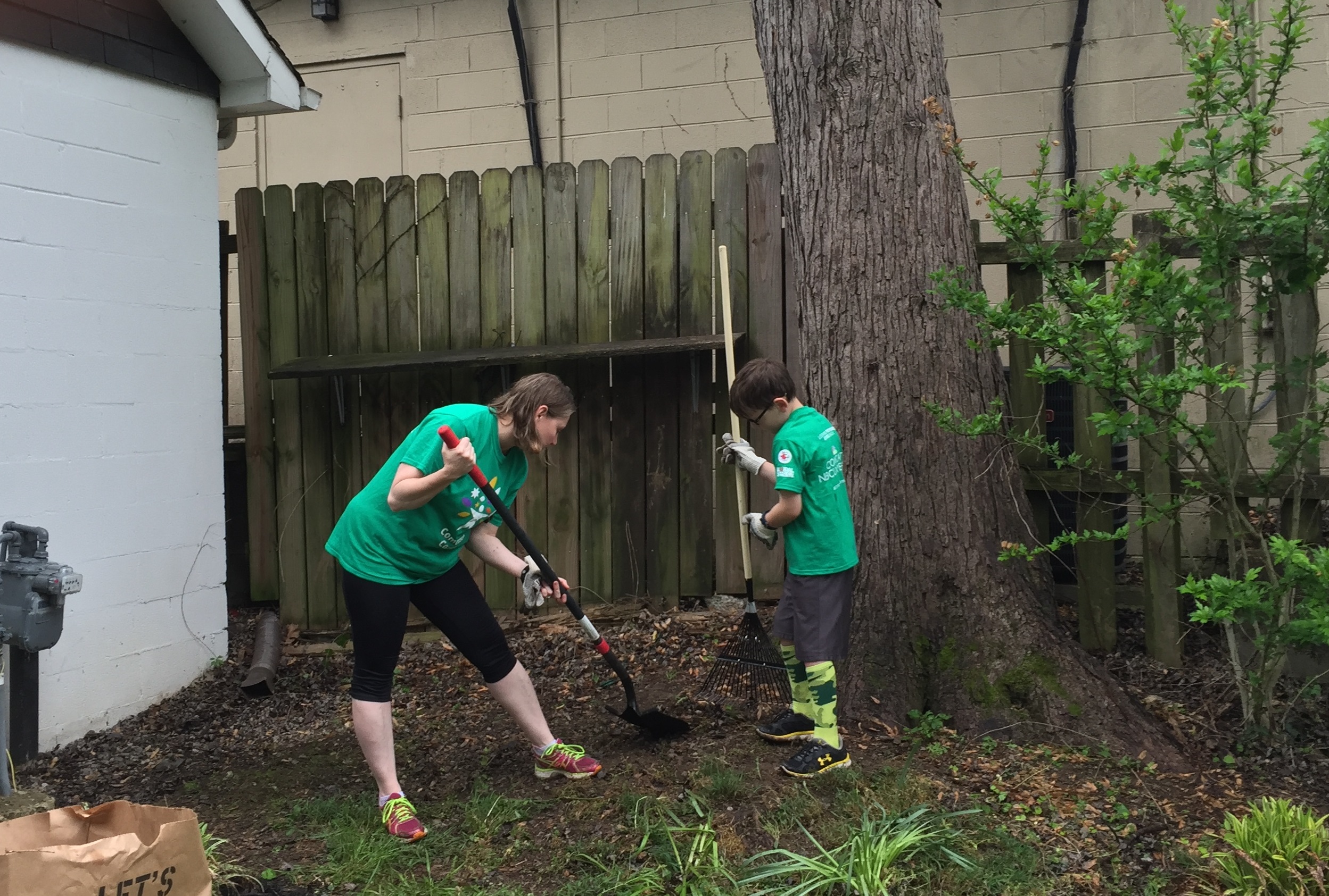 Comcast Employee Kim Sasser Hayden and her son help spruce up the JL Clay Center for the 15th Comcast Cares Day volunteer project in Franklin.jpg