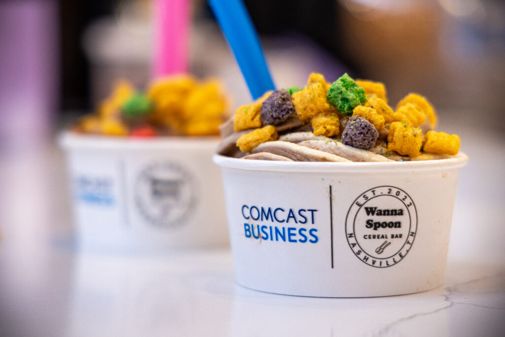 Families enjoying afternoon treats hosted by Comcast Business at Wanna Spoon Cereal Bar in Nashville, Tennessee.